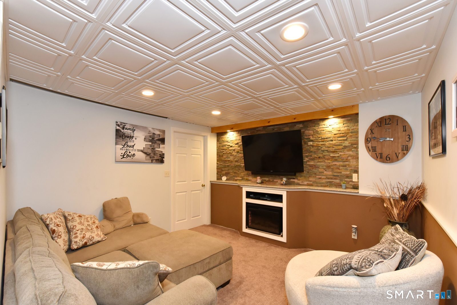 31 North Maple Street East Hampton, CT 06424 - Photo 31 of 38 a living room with furniture and a flat screen tv