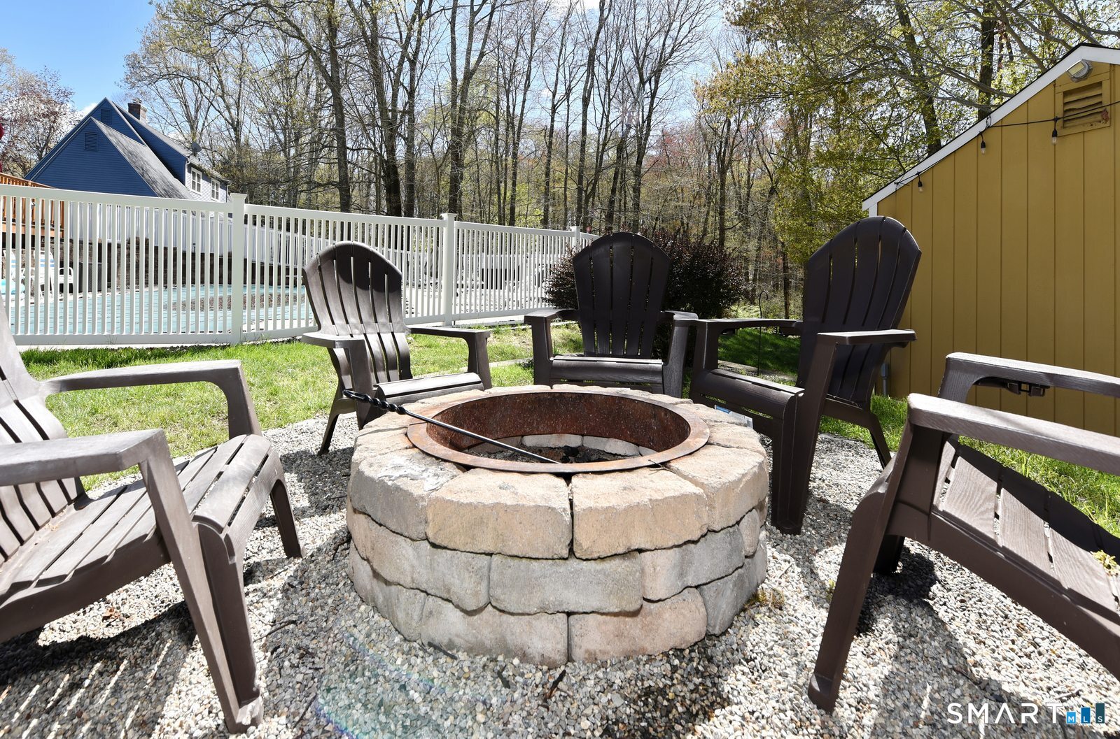 31 North Maple Street East Hampton, CT 06424 - Photo 37 of 38 a view of an outdoor sitting area with furniture and wooden fence