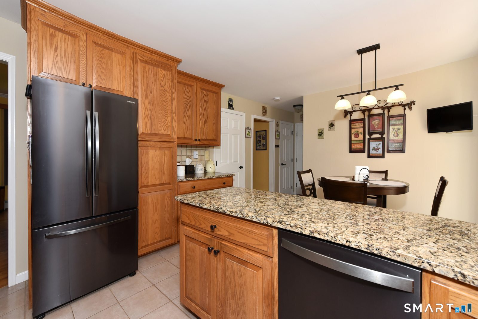31 North Maple Street East Hampton, CT 06424 - Photo 10 of 38 a kitchen with stainless steel appliances granite countertop a refrigerator a sink and a stove