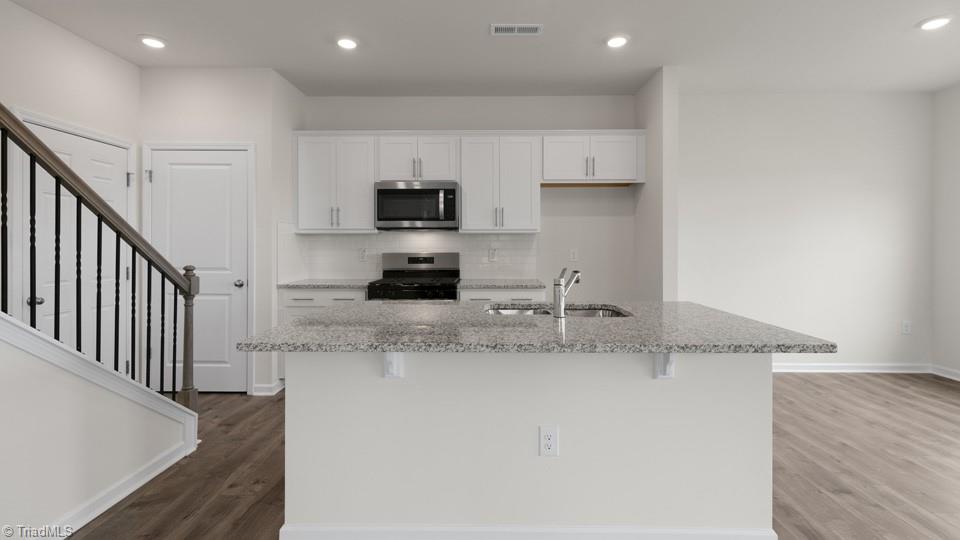 7037 Eclipse Trail Whitsett, NC 27377 - Photo 4 of 25 *photos are of model home and are for representational purposes only.