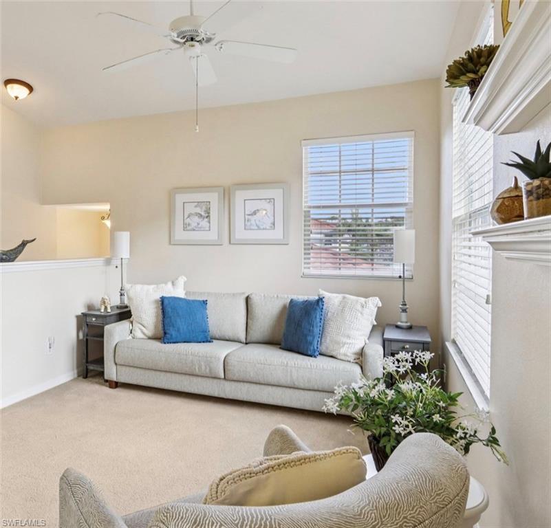 10911 Oak Island Road, Unit 201 Estero, FL 34135 - Photo 11 of 24 a living room with furniture and a large window
