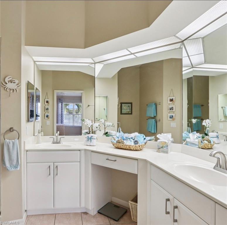 10911 Oak Island Road, Unit 201 Estero, FL 34135 - Photo 13 of 24 a bathroom with a sink and a mirror