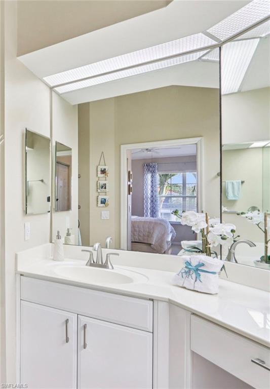 10911 Oak Island Road, Unit 201 Estero, FL 34135 - Photo 14 of 24 a bathroom with a sink and a mirror