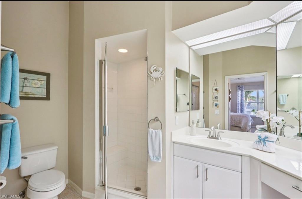 10911 Oak Island Road, Unit 201 Estero, FL 34135 - Photo 15 of 24 a bathroom with a sink a toilet and shower
