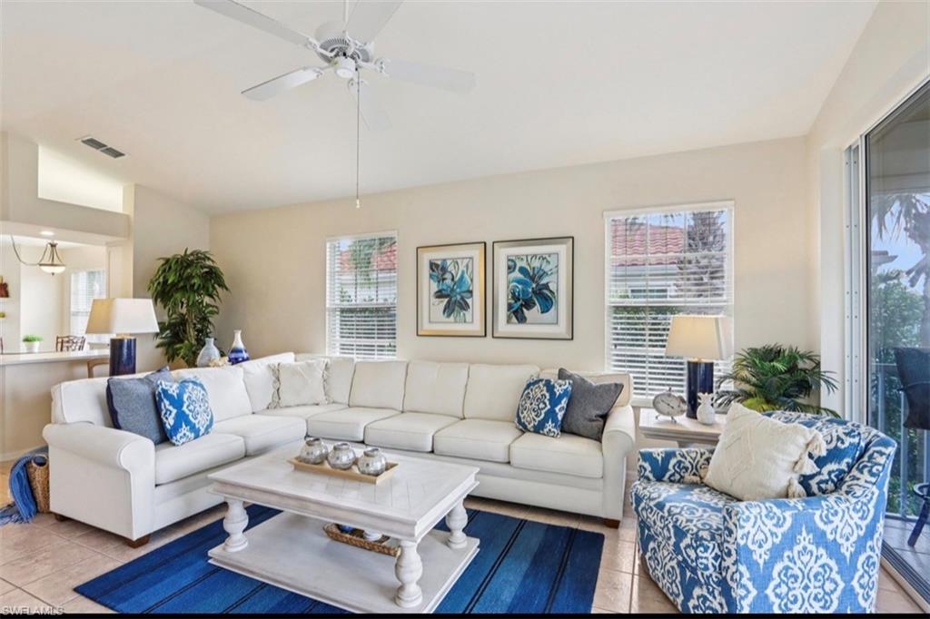 10911 Oak Island Road, Unit 201 Estero, FL 34135 - Photo 2 of 24 a living room with furniture or couch and a wooden floor