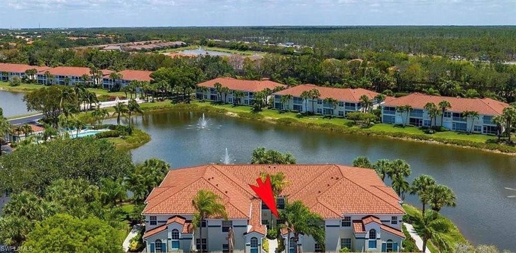 10911 Oak Island Road, Unit 201 Estero, FL 34135 - Photo 21 of 24 an aerial view of residential houses with outdoor space and lake view