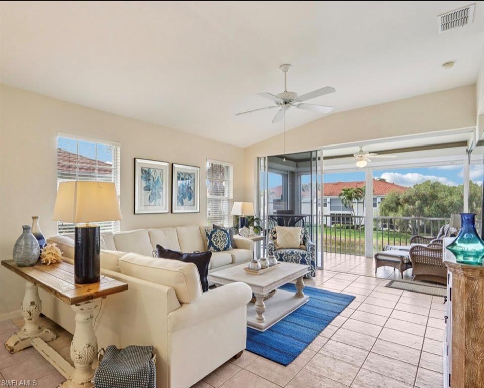 10911 Oak Island Road, Unit 201 Estero, FL 34135 - Photo 7 of 24 a living room with furniture fireplace and a table