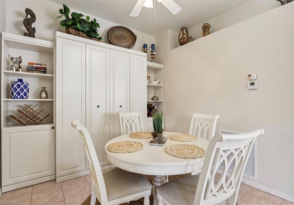 10911 Oak Island Road, Unit 201 Estero, FL 34135 - Photo 8 of 24 a view of a dining room with furniture