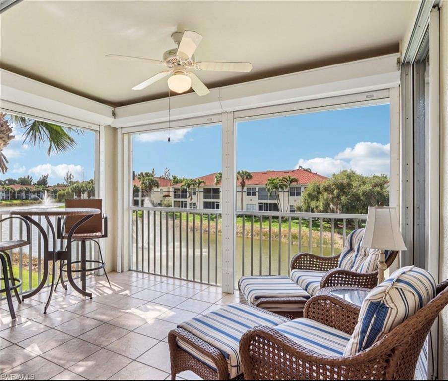 10911 Oak Island Road, Unit 201 Estero, FL 34135 - Photo 10 of 24 a bedroom with furniture and a large window