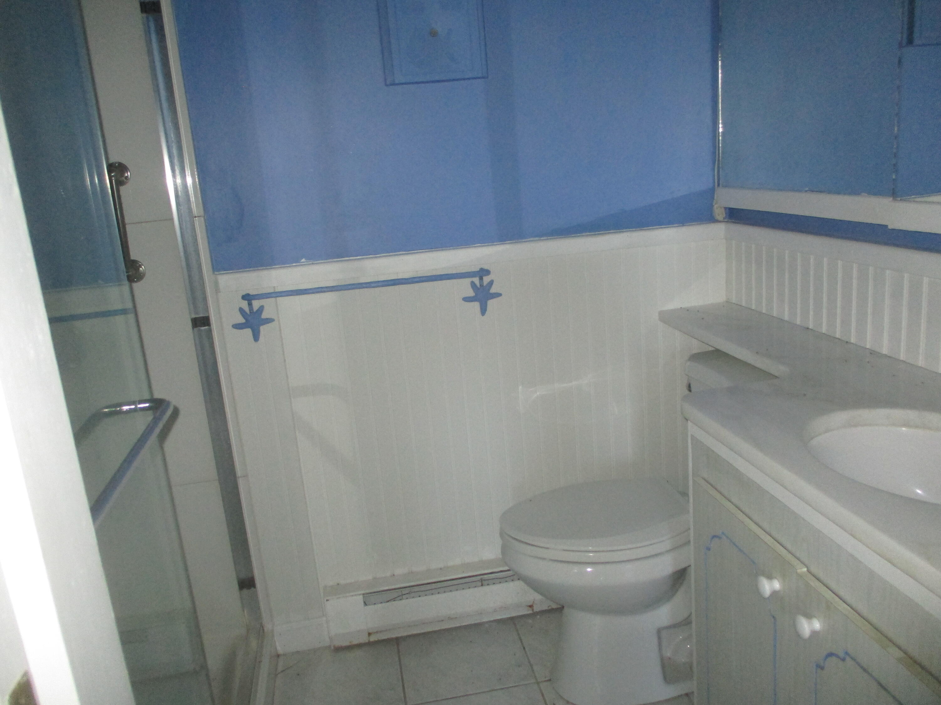 112 Old Wharf Road, Unit E4 Dennis Port, MA 02639 - Photo 11 of 15 a bathroom with a toilet and a shower