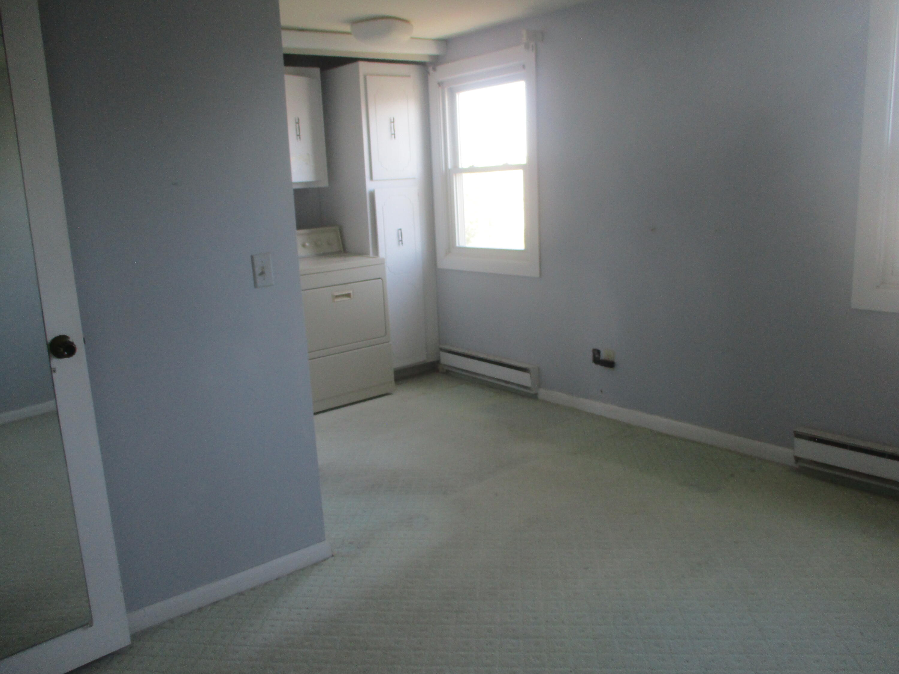 112 Old Wharf Road, Unit E4 Dennis Port, MA 02639 - Photo 14 of 15 an empty room with windows