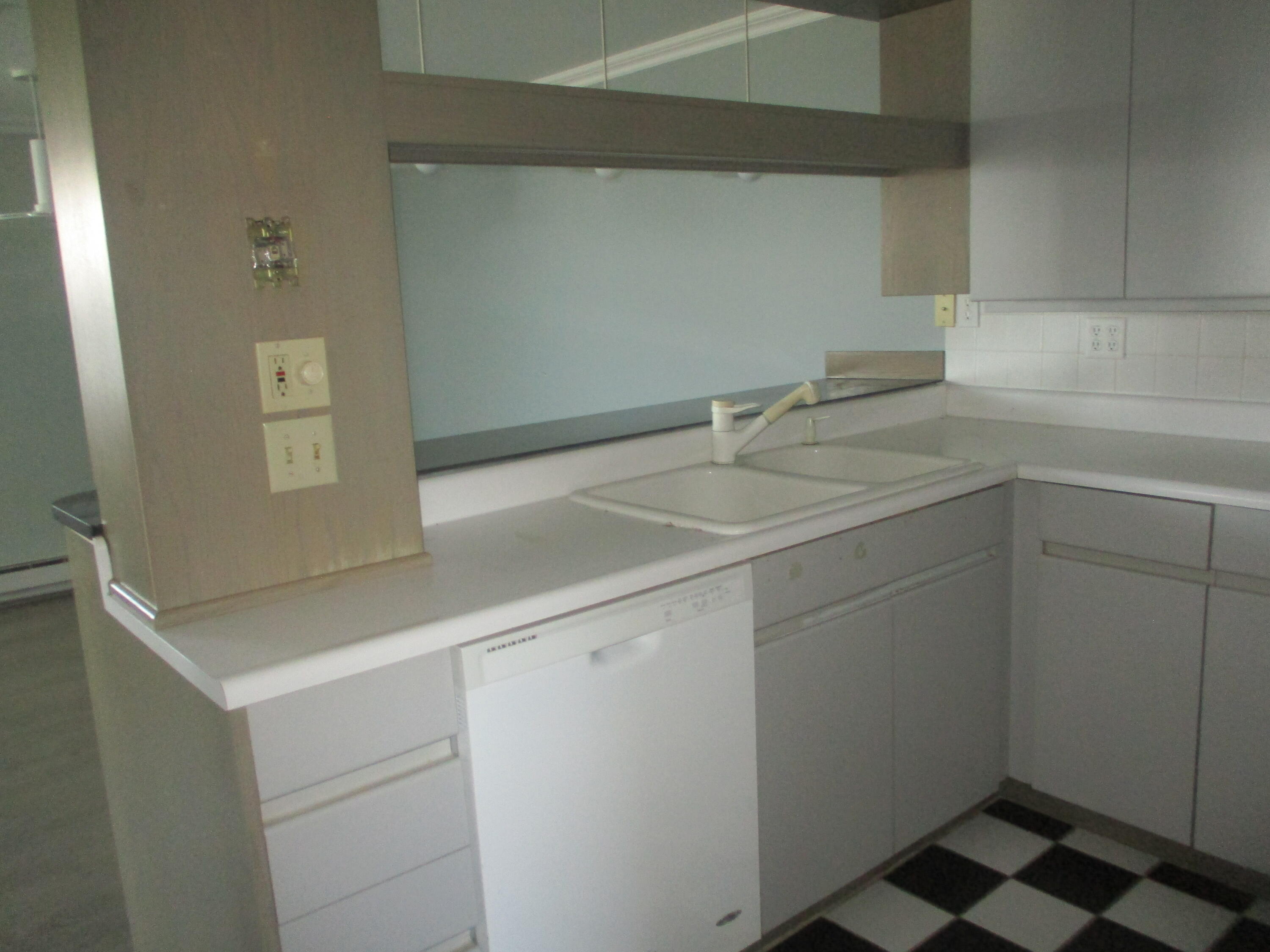 112 Old Wharf Road, Unit E4 Dennis Port, MA 02639 - Photo 7 of 15 a utility room with cabinets