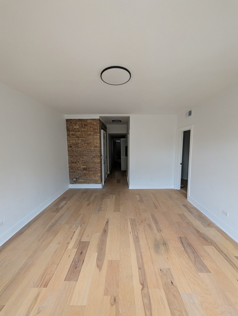 616 West Patterson Avenue, Unit 2E Chicago, IL 60613 - Photo 4 of 18 a view of a room with furniture and window