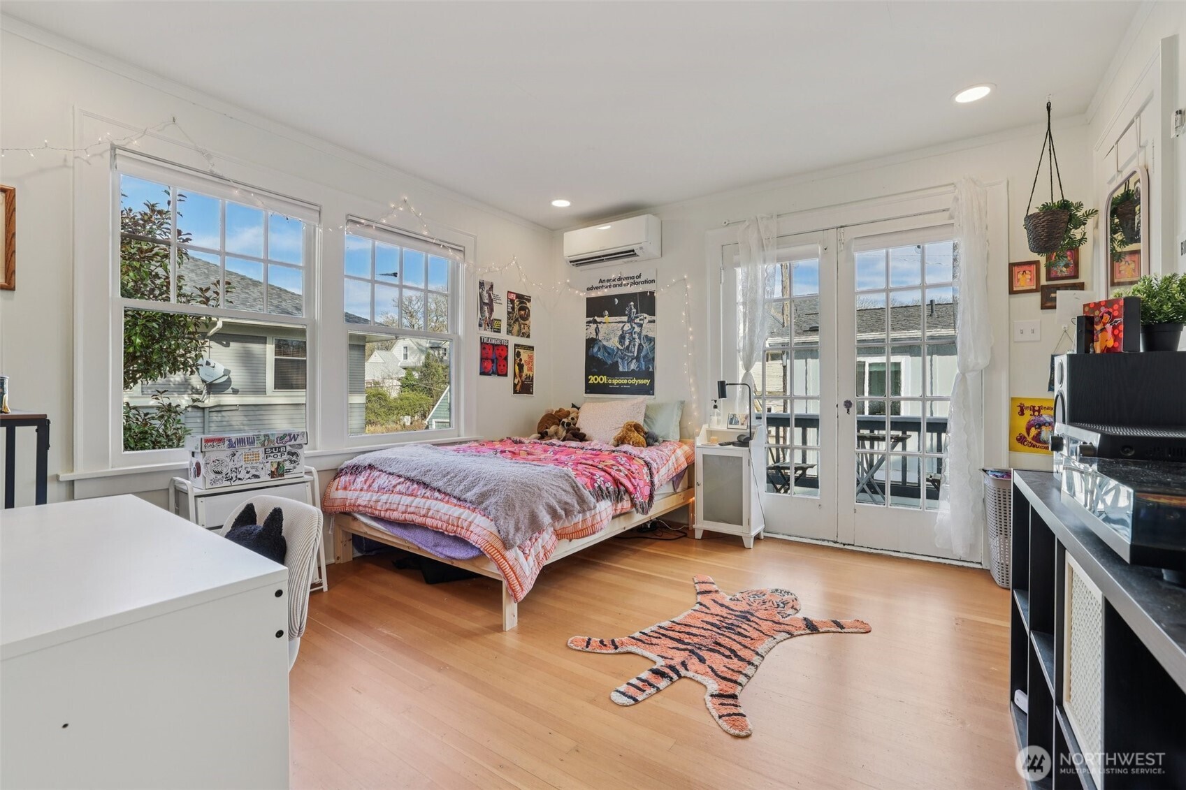 5230 16th Avenue Northeast Seattle, WA 98105 - Photo 11 of 35 a bedroom with a bed and a large window