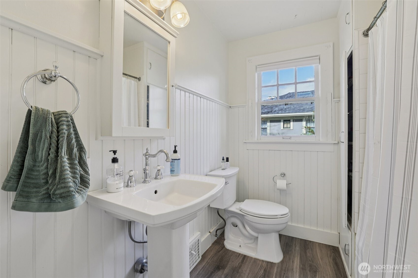 5230 16th Avenue Northeast Seattle, WA 98105 - Photo 15 of 35 a bathroom with a sink a toilet and a mirror