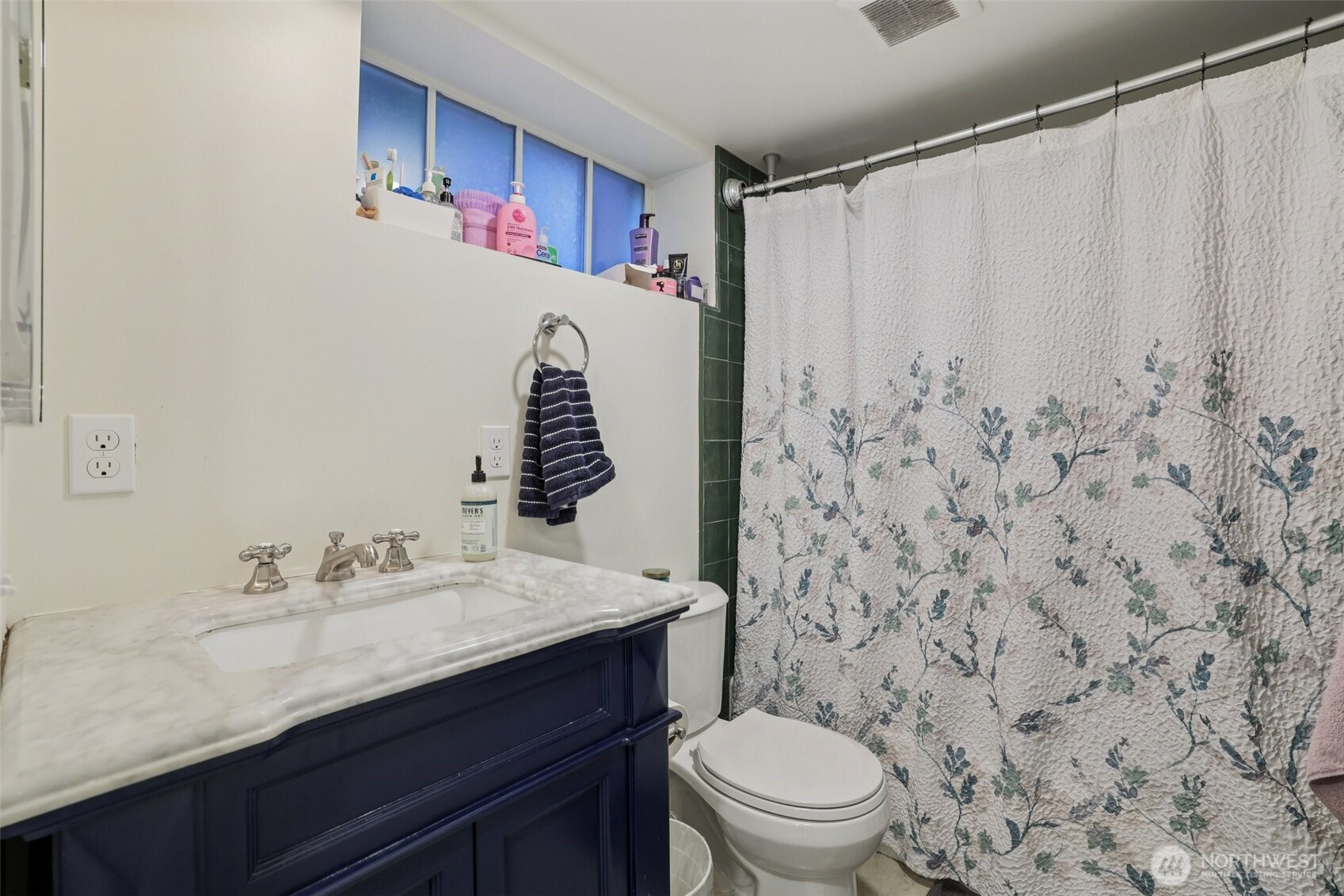 5230 16th Avenue Northeast Seattle, WA 98105 - Photo 20 of 35 a bathroom with a sink and a mirror