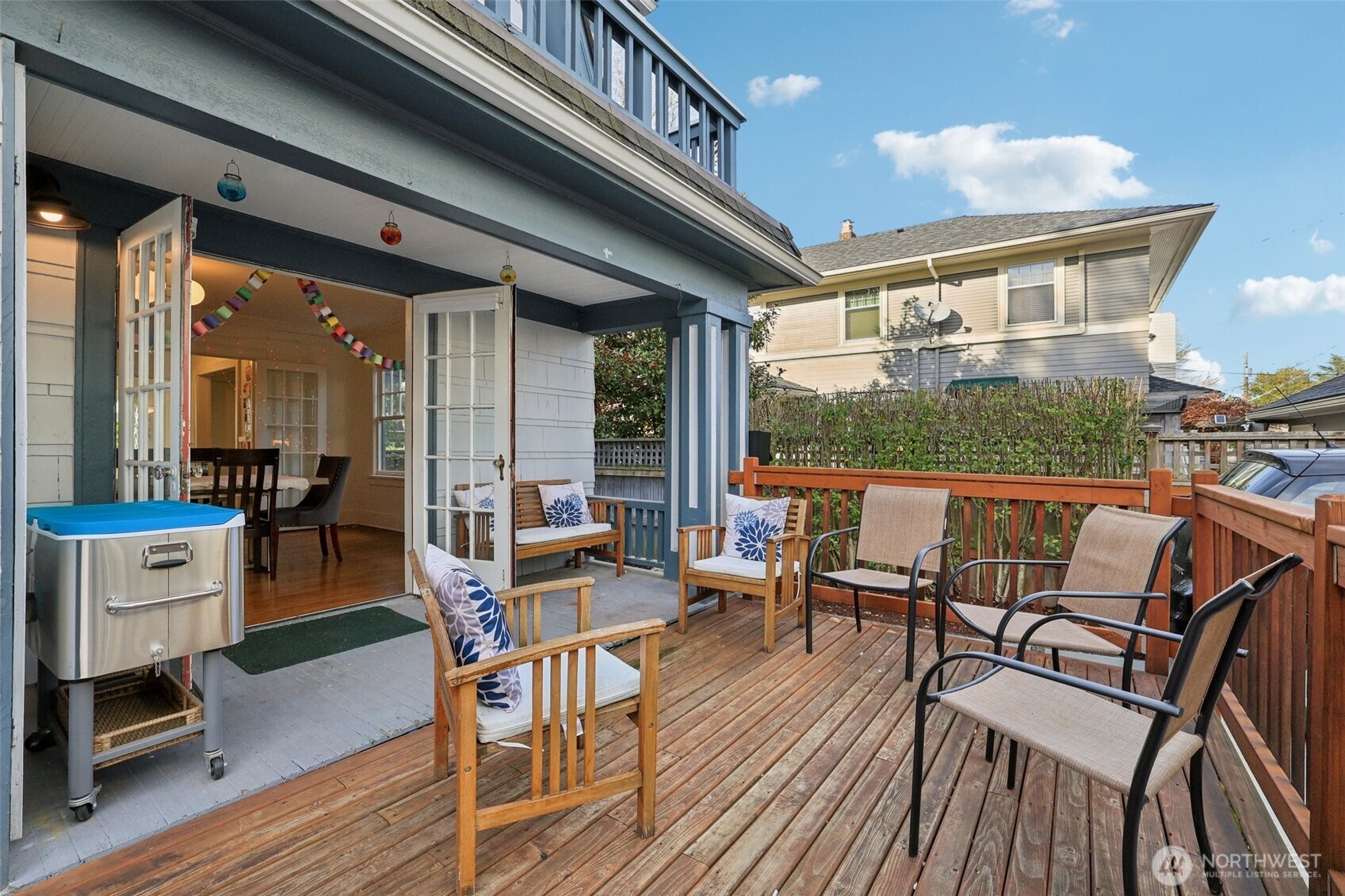 5230 16th Avenue Northeast Seattle, WA 98105 - Photo 21 of 35 a dining room with wooden floor a glass table and chairs