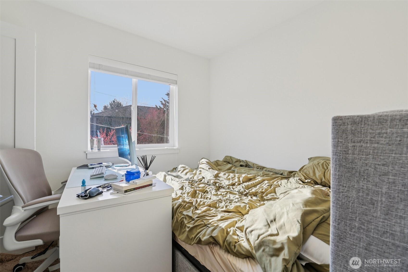 5230 16th Avenue Northeast Seattle, WA 98105 - Photo 29 of 35 a bedroom with a bed and a window
