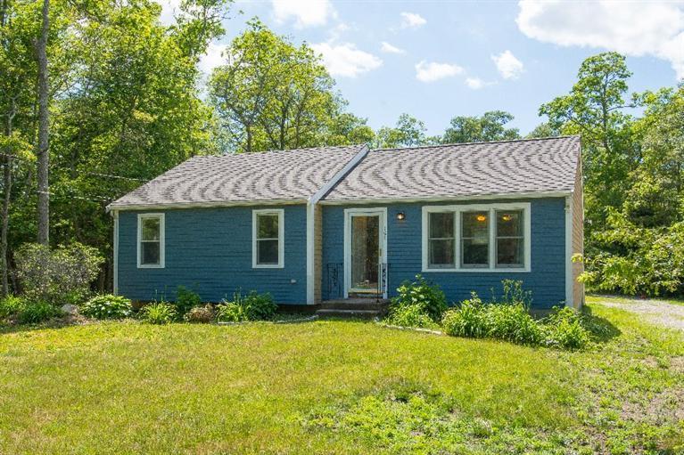 105 Cammett Road Marstons Mills, MA 02648 - Photo 1 of 21 a view of a house with a yard and plants