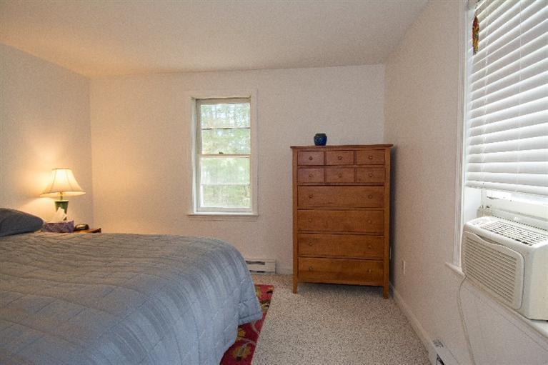105 Cammett Road Marstons Mills, MA 02648 - Photo 12 of 21 a bedroom with a bed and a window