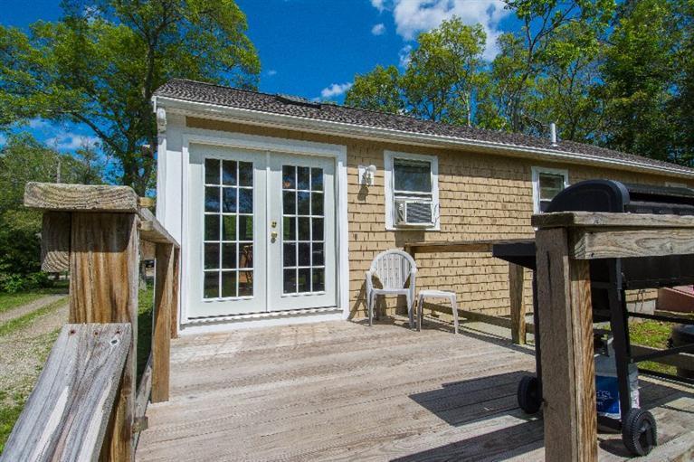 105 Cammett Road Marstons Mills, MA 02648 - Photo 16 of 21 a front view of a house with a garden