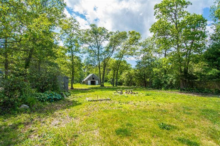 105 Cammett Road Marstons Mills, MA 02648 - Photo 17 of 21 a view of a backyard with large trees
