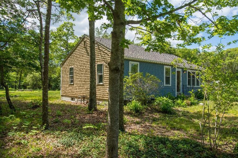 105 Cammett Road Marstons Mills, MA 02648 - Photo 5 of 21 a view of a pathway of a house with a yard