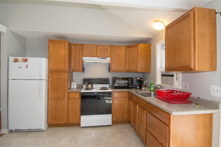 105 Cammett Road Marstons Mills, MA 02648 - Photo 6 of 21 a kitchen with a sink stove and refrigerator
