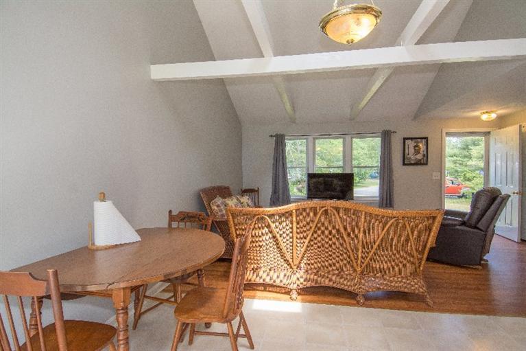 105 Cammett Road Marstons Mills, MA 02648 - Photo 8 of 21 a view of a dining room with furniture and wooden floor