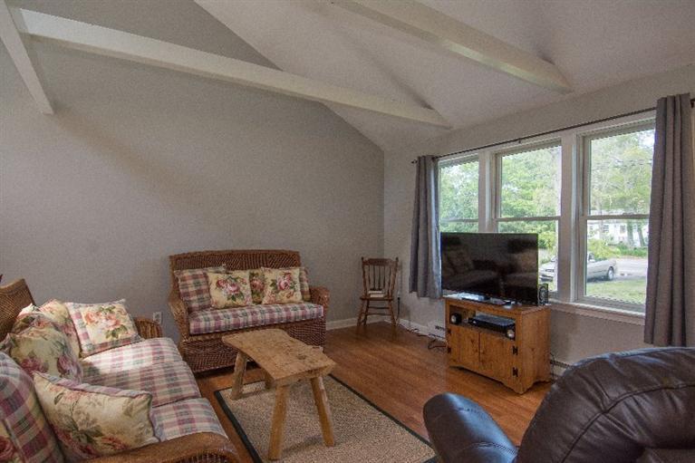 105 Cammett Road Marstons Mills, MA 02648 - Photo 9 of 21 a living room with furniture and a flat screen tv