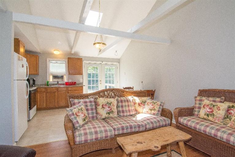 105 Cammett Road Marstons Mills, MA 02648 - Photo 10 of 21 a living room with furniture and a large window