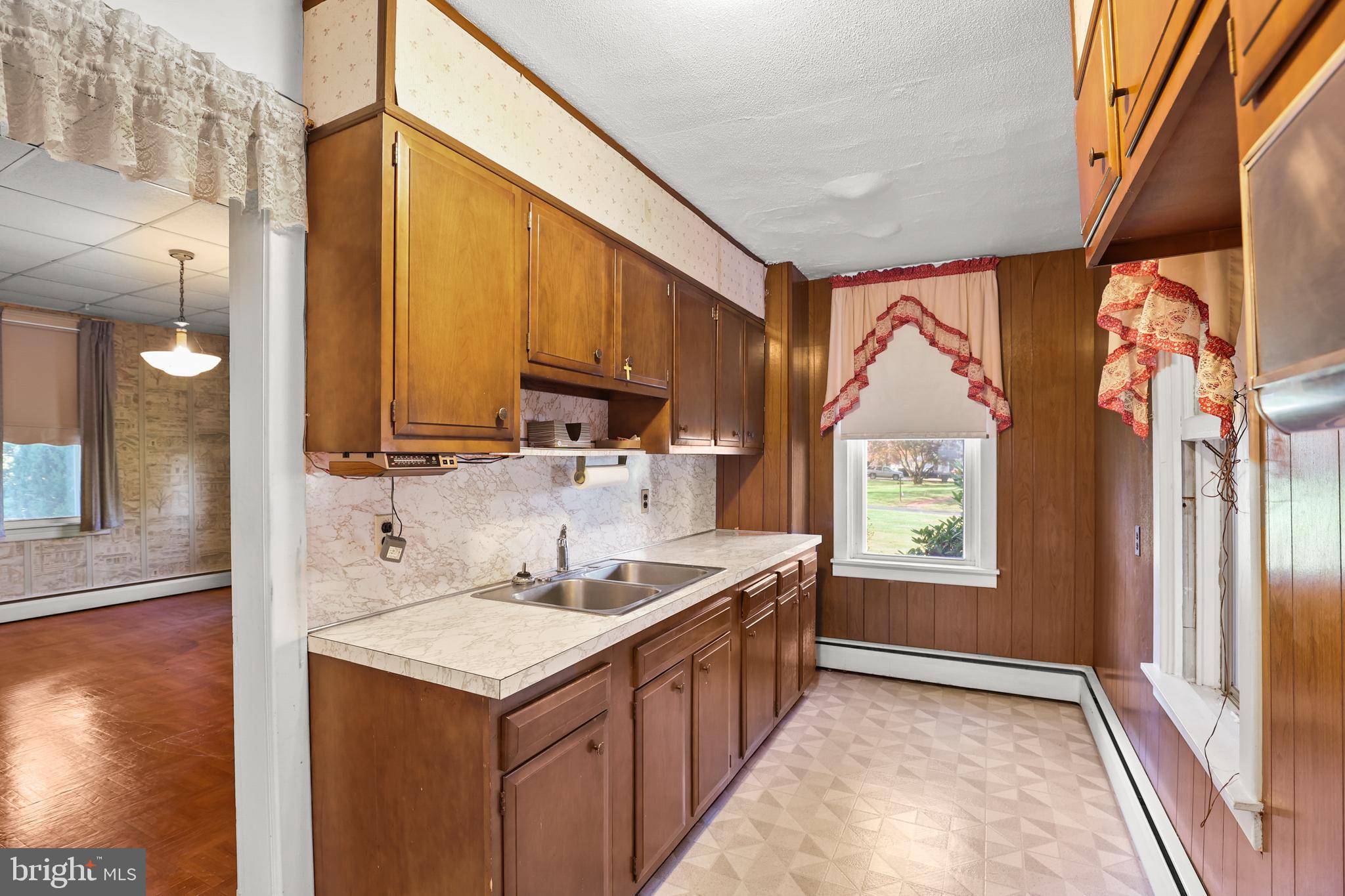 920 North Houcksville Road Hampstead, MD 21074 - Photo 14 of 36 a kitchen with a sink stove and cabinets
