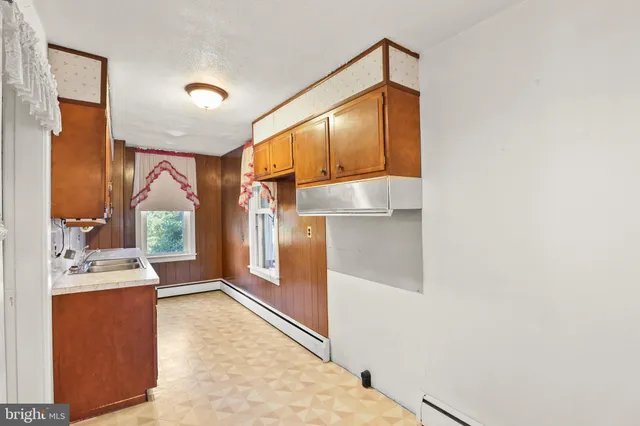 a bathroom with a sink and mirror