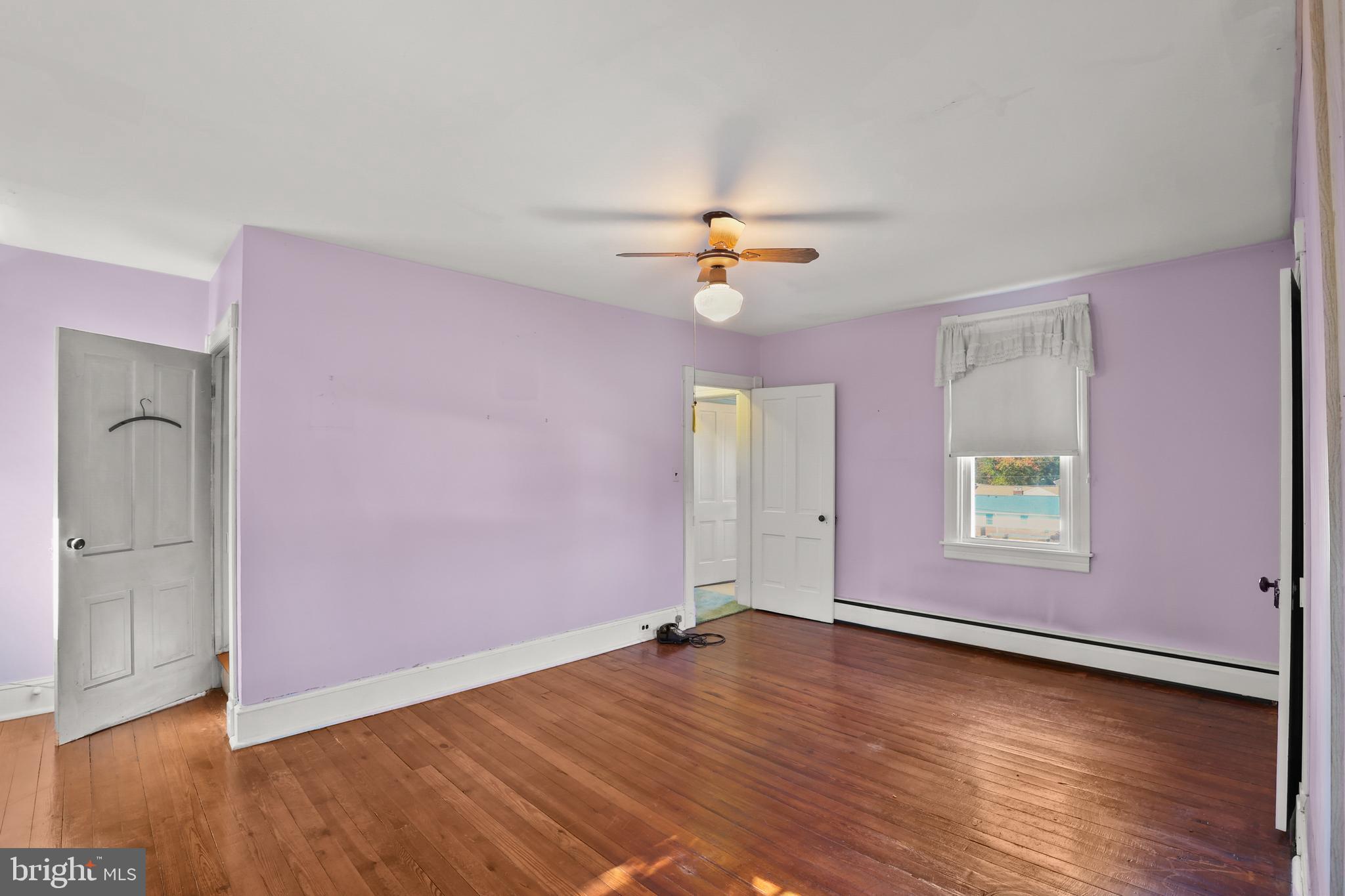 920 North Houcksville Road Hampstead, MD 21074 - Photo 18 of 36 an empty room with wooden floor and window