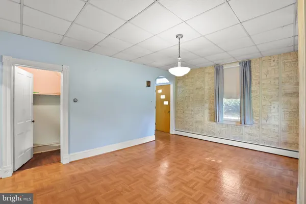 a view of an empty room with a window