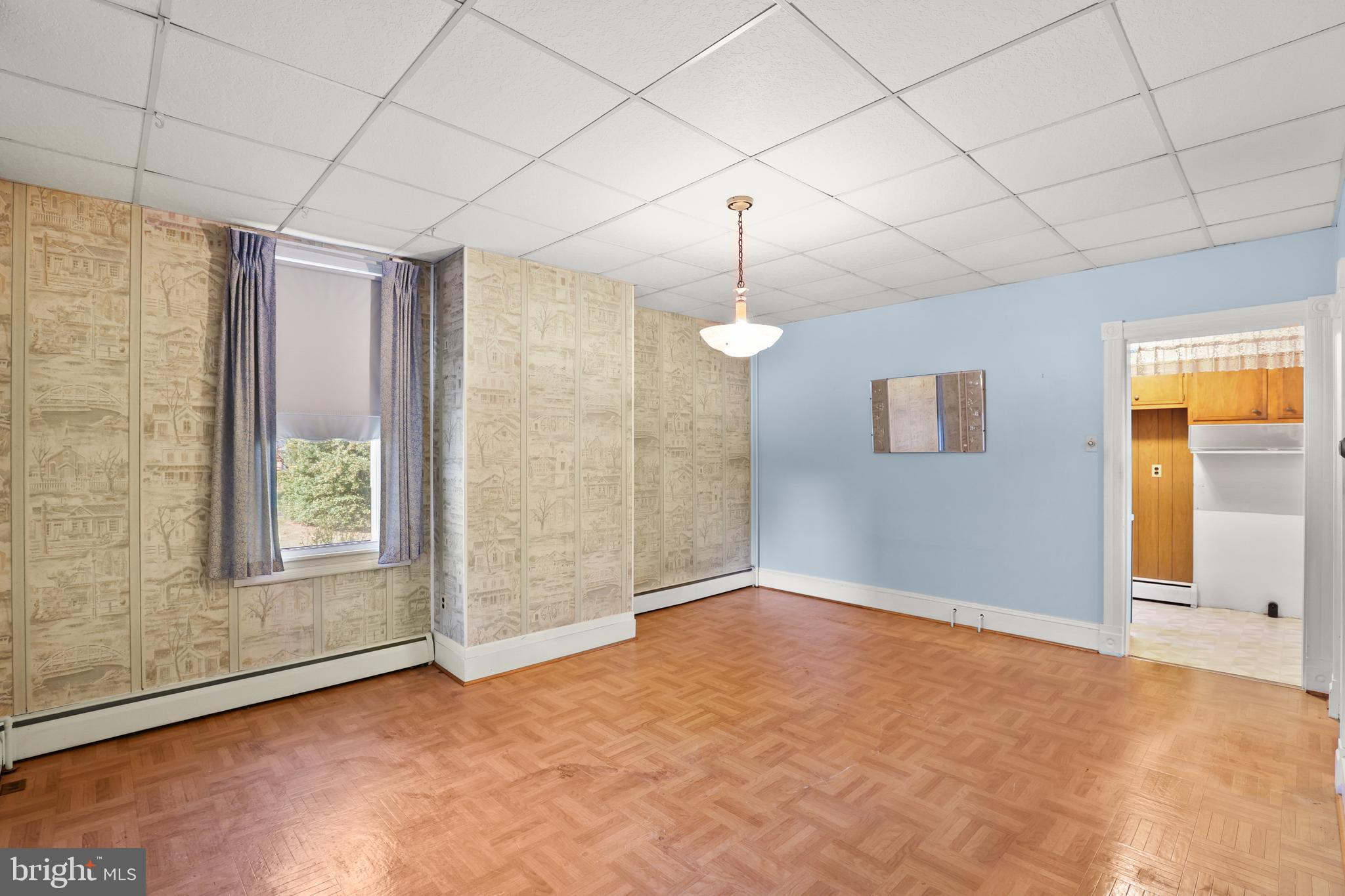 920 North Houcksville Road Hampstead, MD 21074 - Photo 22 of 36 an empty room with chandelier fan and windows