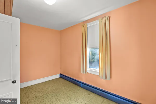 a view of a room with a large window