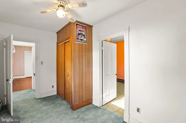 a view of a hallway with closet area