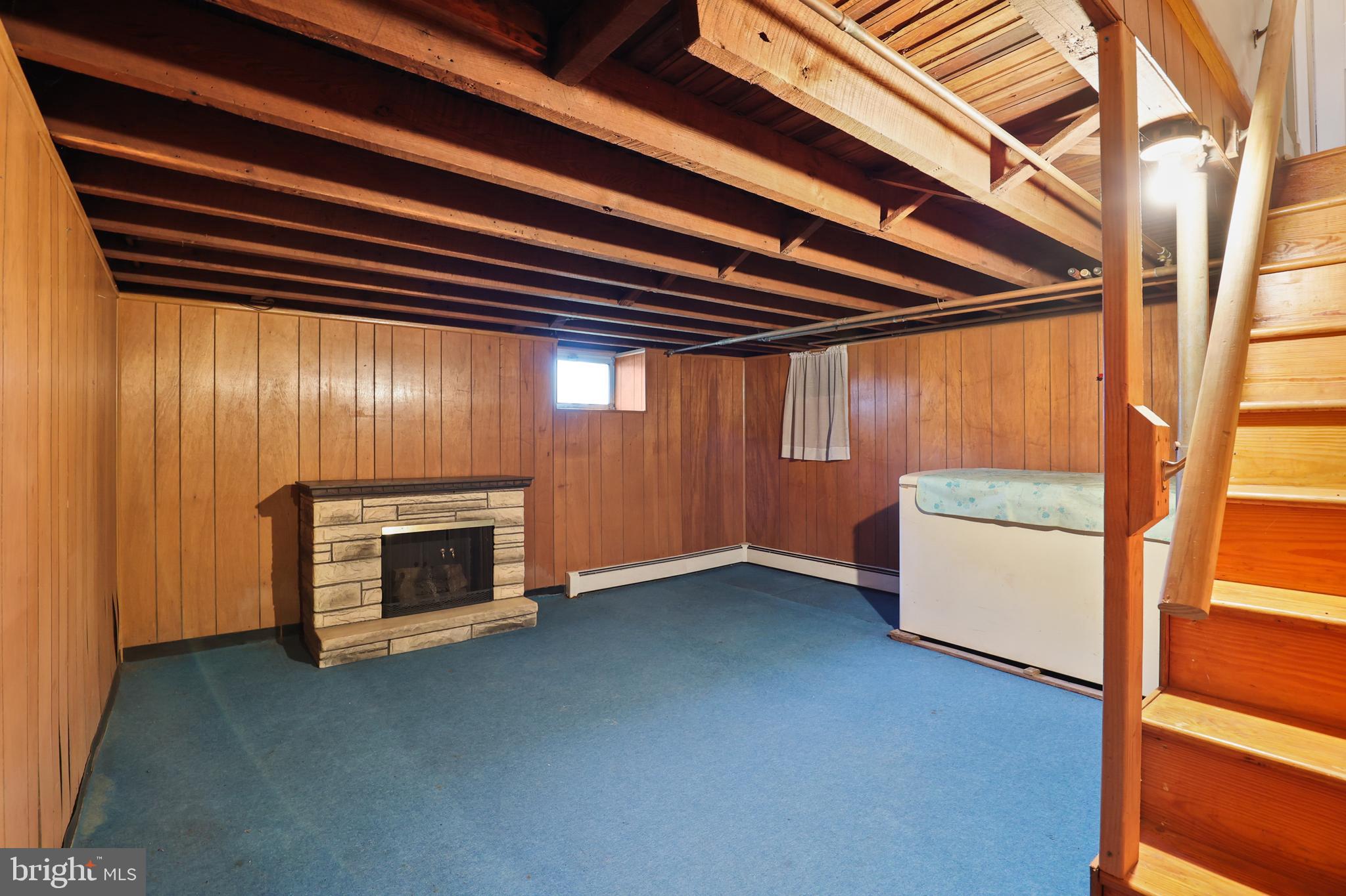 920 North Houcksville Road Hampstead, MD 21074 - Photo 30 of 36 a view of an empty room with a fireplace and a window