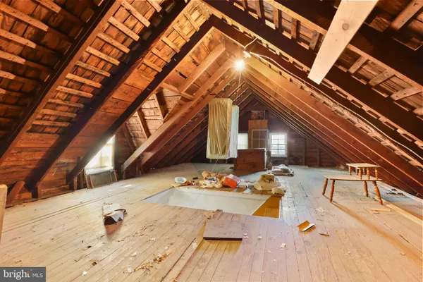 a view of a livingroom with an empty space and a window