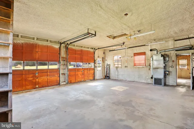 a view of room with walk in closet and window