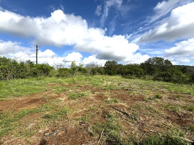 a view of outdoor space and green field