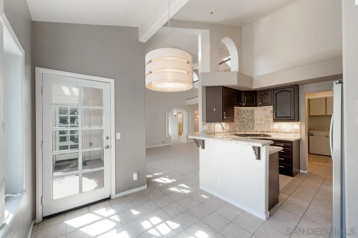 2836 Torrey Pines Road La Jolla, CA 92037 - Photo 12 of 35 a kitchen with a sink cabinets and a window