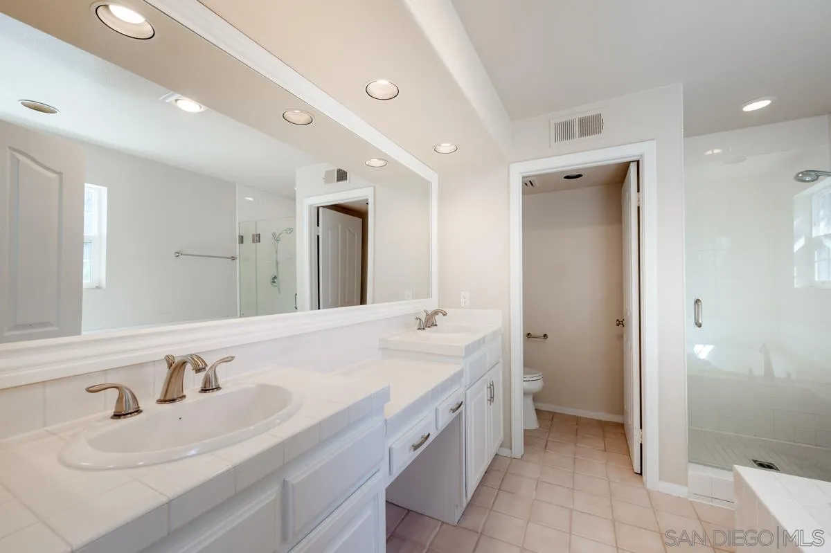 2836 Torrey Pines Road La Jolla, CA 92037 - Photo 21 of 35 a spacious bathroom with a double vanity sink mirror and double