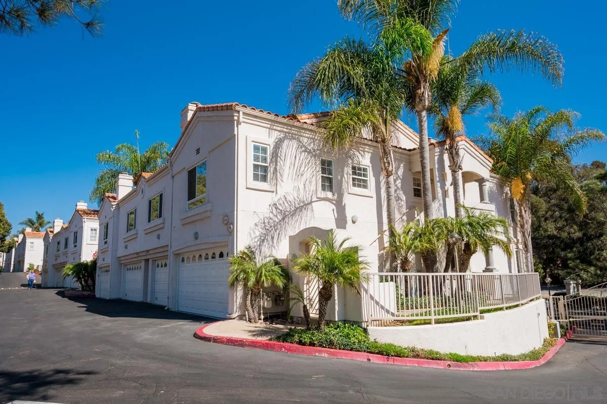 2836 Torrey Pines Road La Jolla, CA 92037 - Photo 3 of 35 a view of a white house with a fountain and potted plants