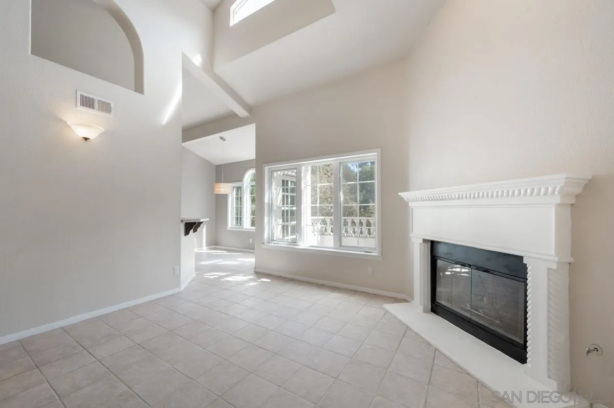 2836 Torrey Pines Road La Jolla, CA 92037 - Photo 10 of 35 a view of an empty room with a fireplace and a window