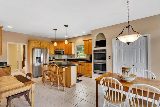 a bedroom with a bed and a large dresser