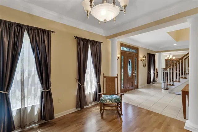 a bed sitting in a room next to a window