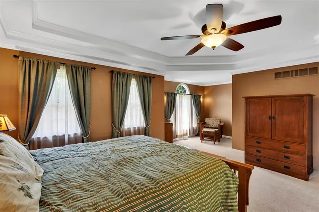 a kitchen with granite countertop cabinets sink and window