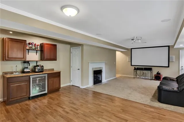 a view of a roof deck with wooden floor and seating space
